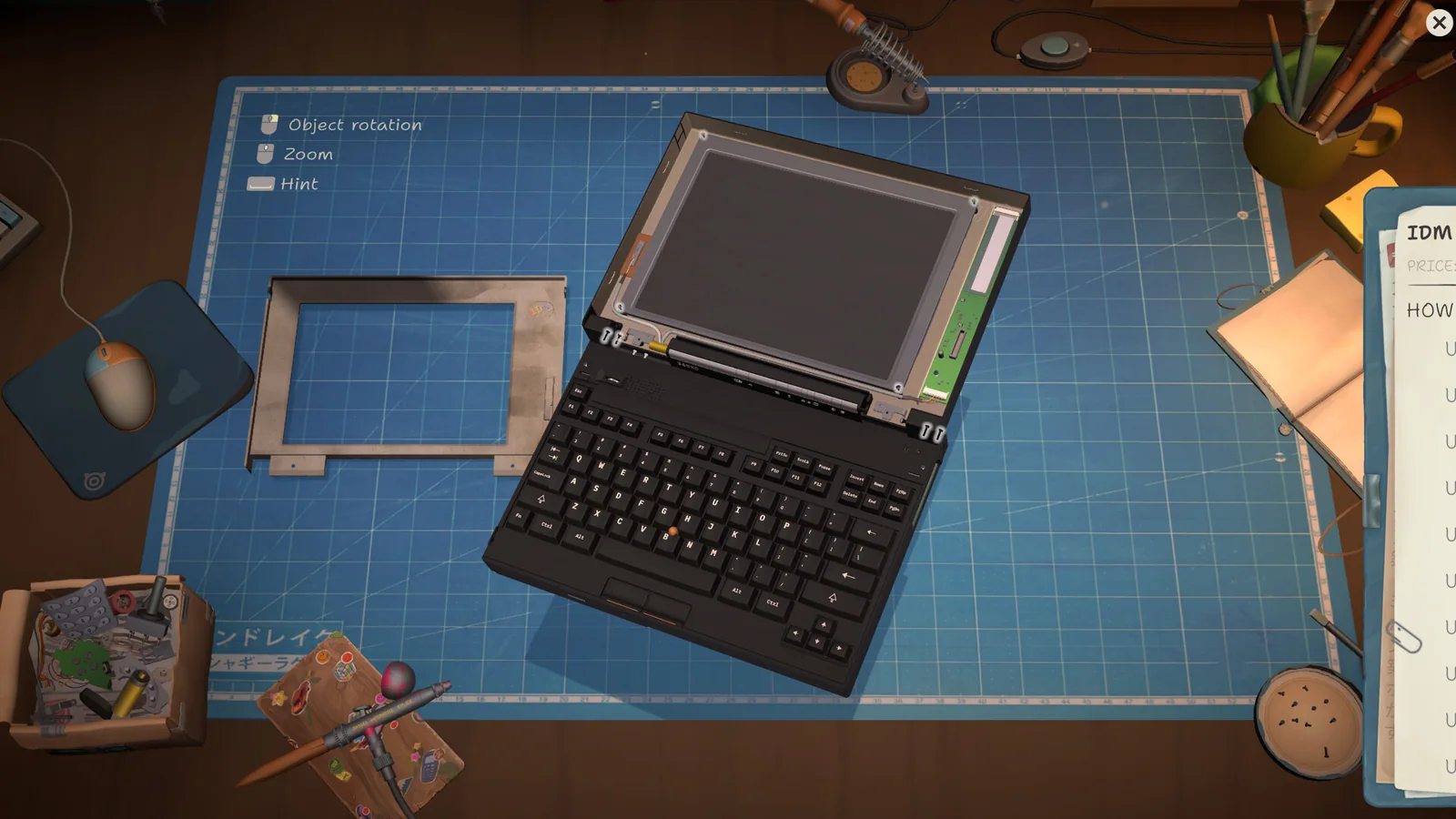 Disassembled laptop on a ReStory repair workbench